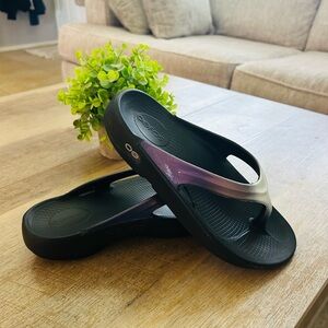 OOFOS Black Flip Flops with Iridescent Purple Straps